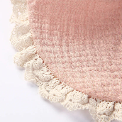 Assortment of muted color cotton bamboo baby bibs, ideal for a newborn gift set.
