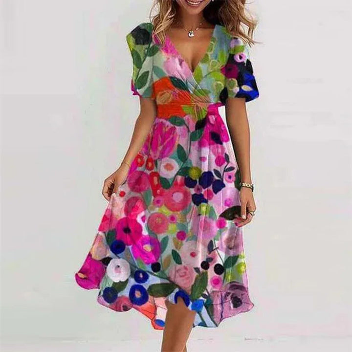 Blue women's A-line midi dress with a flattering V-neck and short sleeves. A versatile and elegant summer or party outfit.
