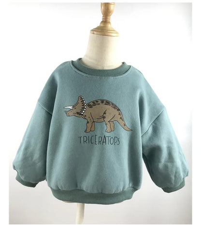Front view of a warm fleece-lined dinosaur sweater, fun and practical children's winter wear