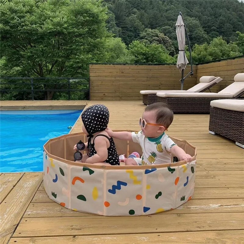 Empty foldable PVC child's playpen and activity pool, highlighting its easy storage and portability