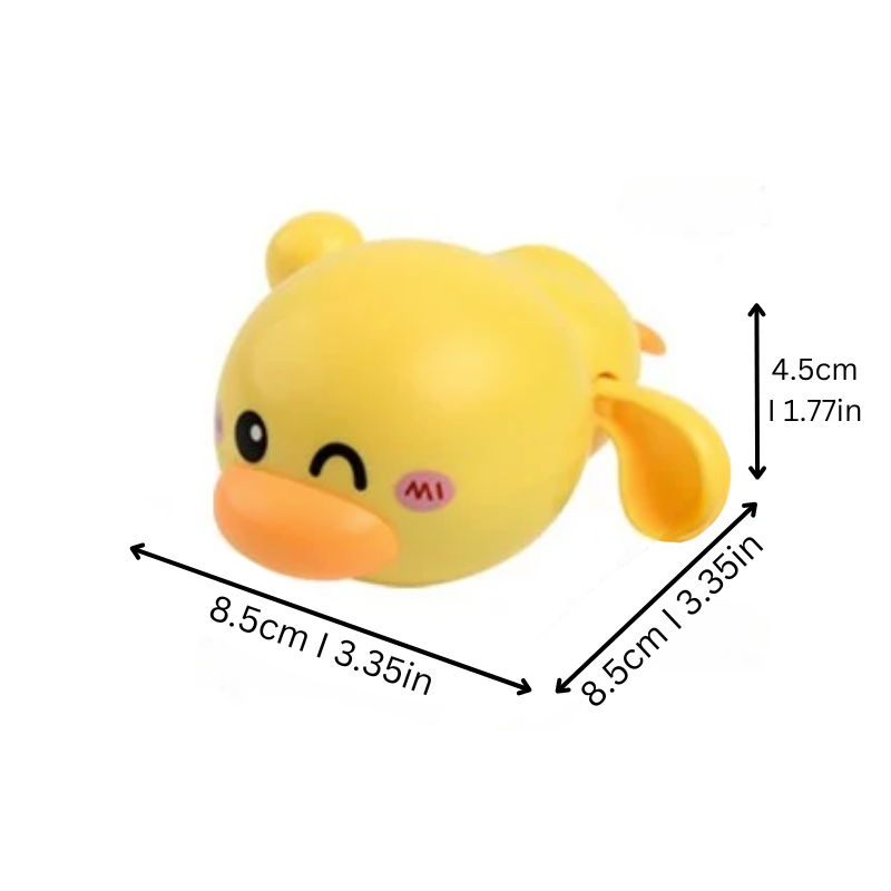 Close-up of a child's hand winding up a vibrant yellow swimming duck bath toy, ready for water fun.