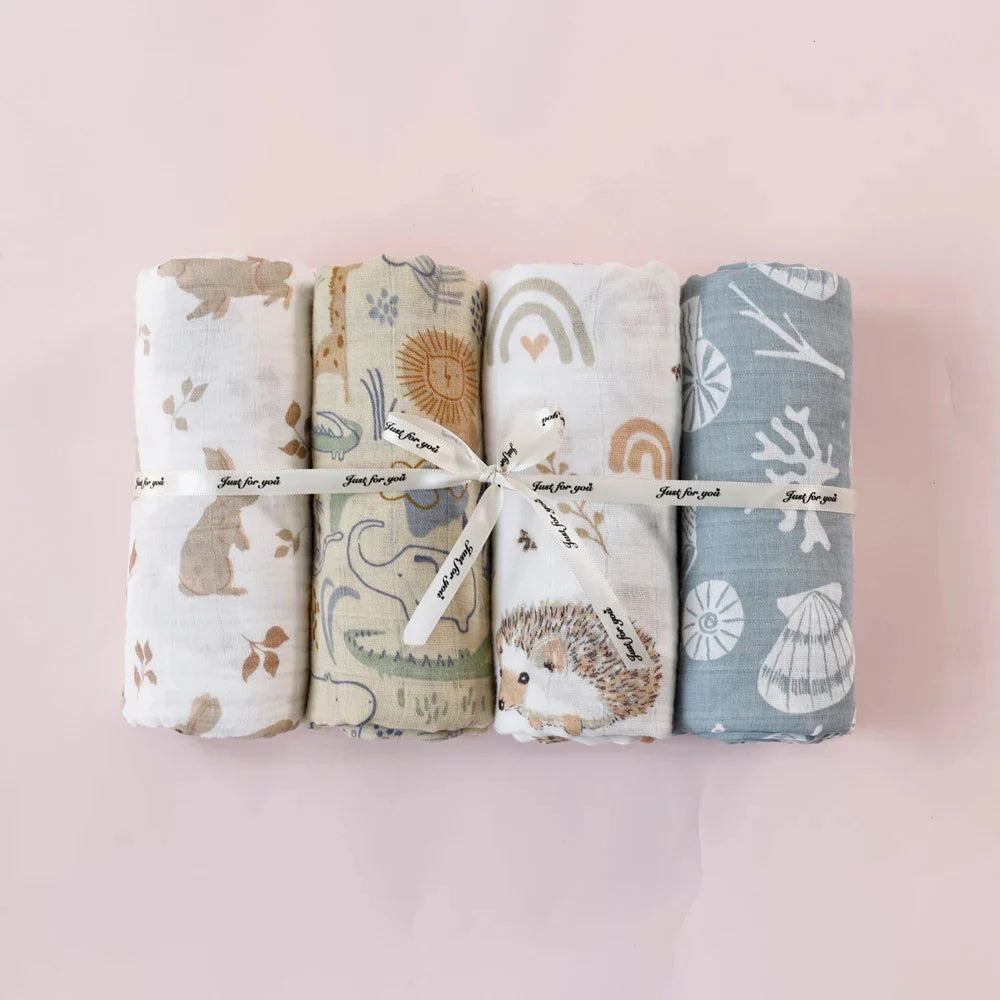Set of four organic bamboo cotton muslin baby blankets, essential for infant care