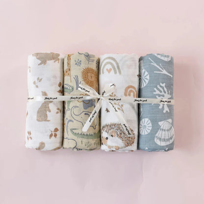 Set of four organic bamboo cotton muslin baby blankets, essential for infant care