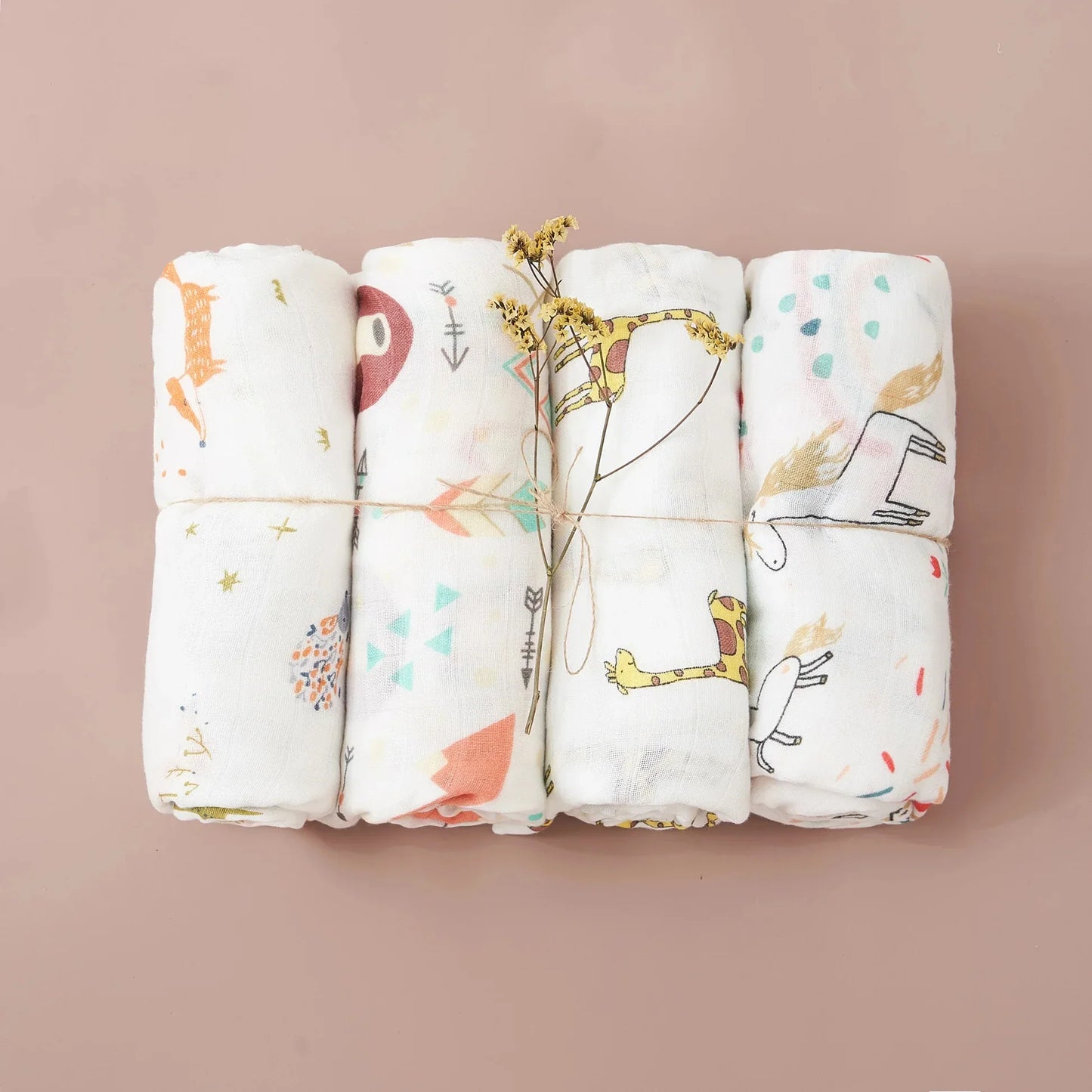 Close up of an embroidered edge on a soft bamboo cotton muslin swaddle blanket