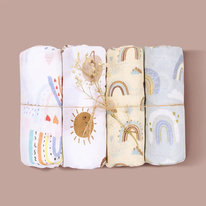 A hand gently touching the soft texture of a bamboo cotton muslin swaddle, baby comfort