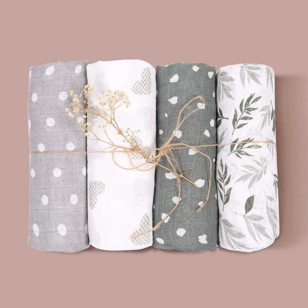 Four varied patterns of bamboo cotton muslin swaddle blankets for babies, multi-use design