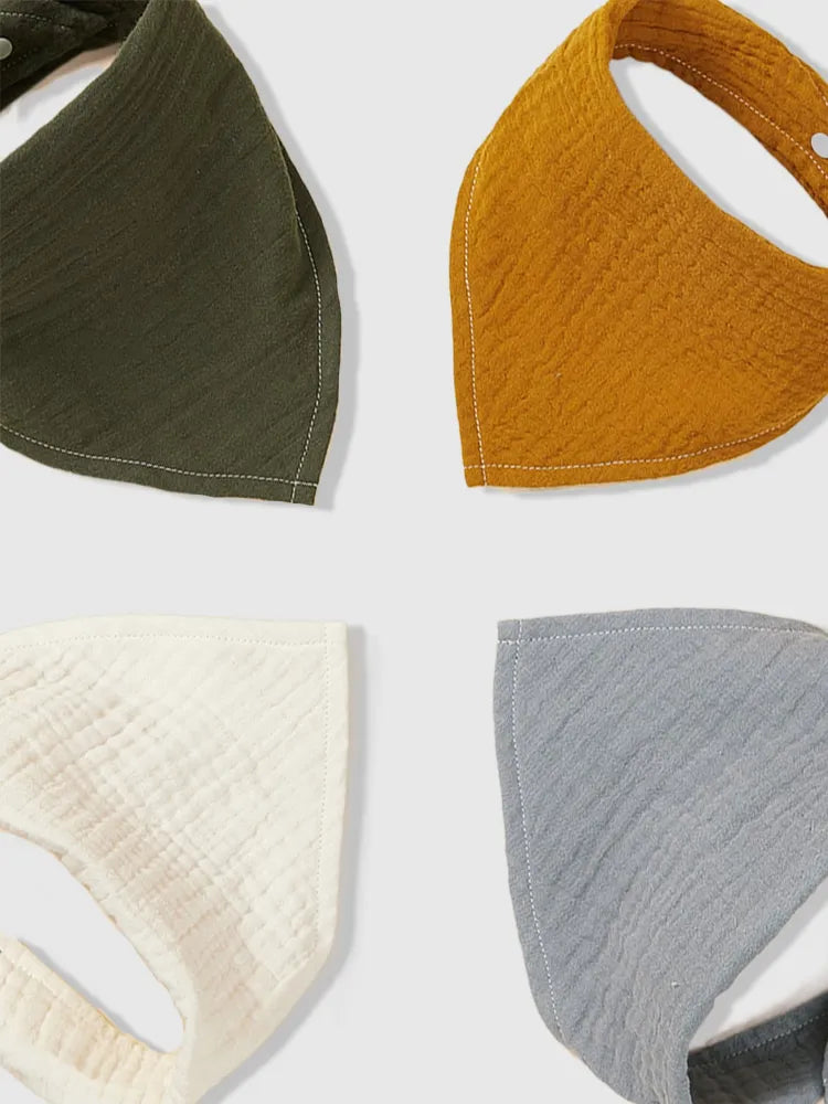 Assorted organic cotton bandana bibs in a 4-pack, ideal baby shower gift