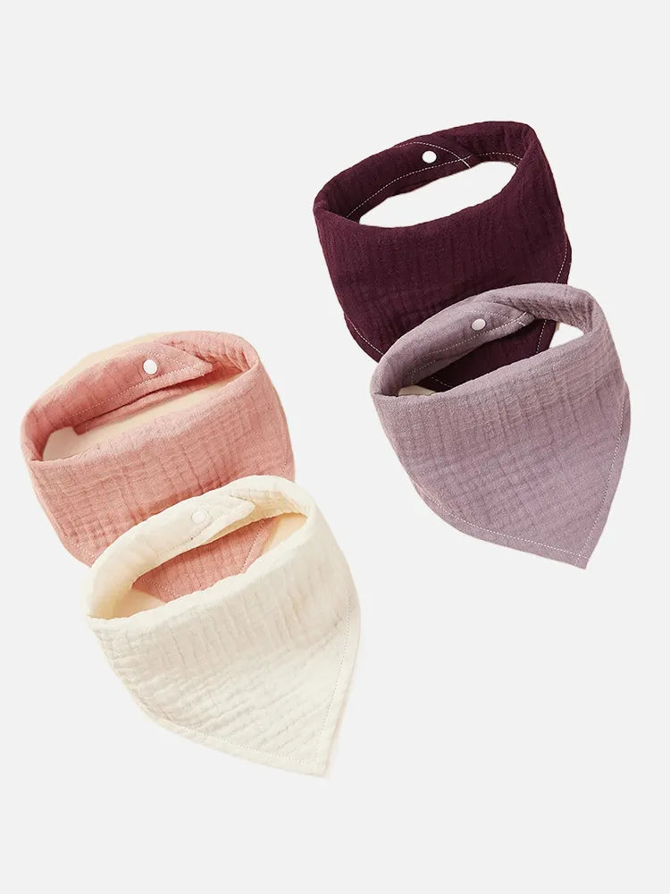 Four pack of premium organic cotton baby bibs, soft and absorbent for everyday use