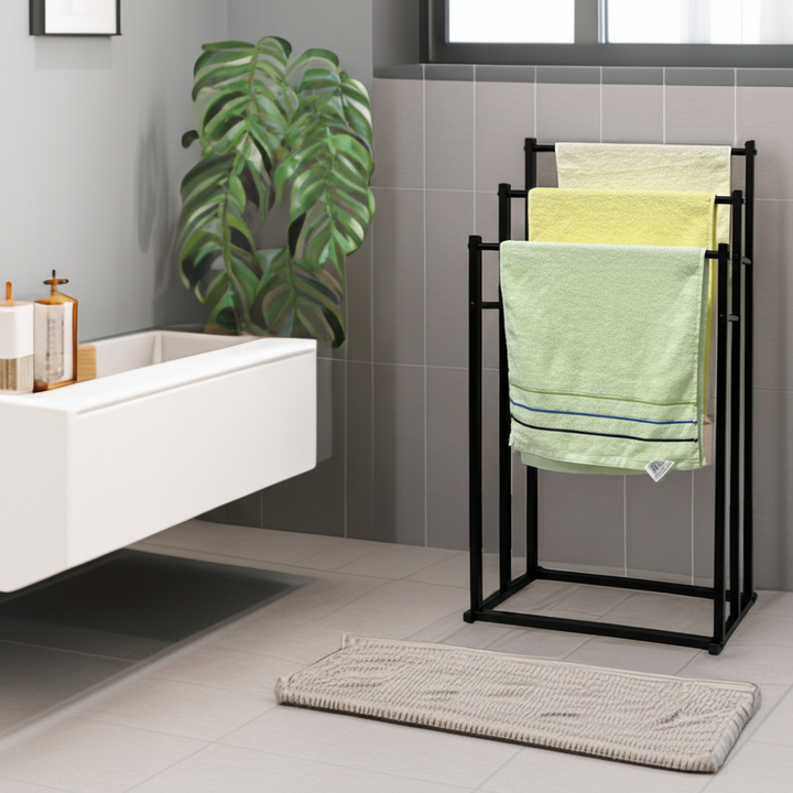 Freestanding steel towel rack for bathroom, perfect for organizing towels & maximizing space.