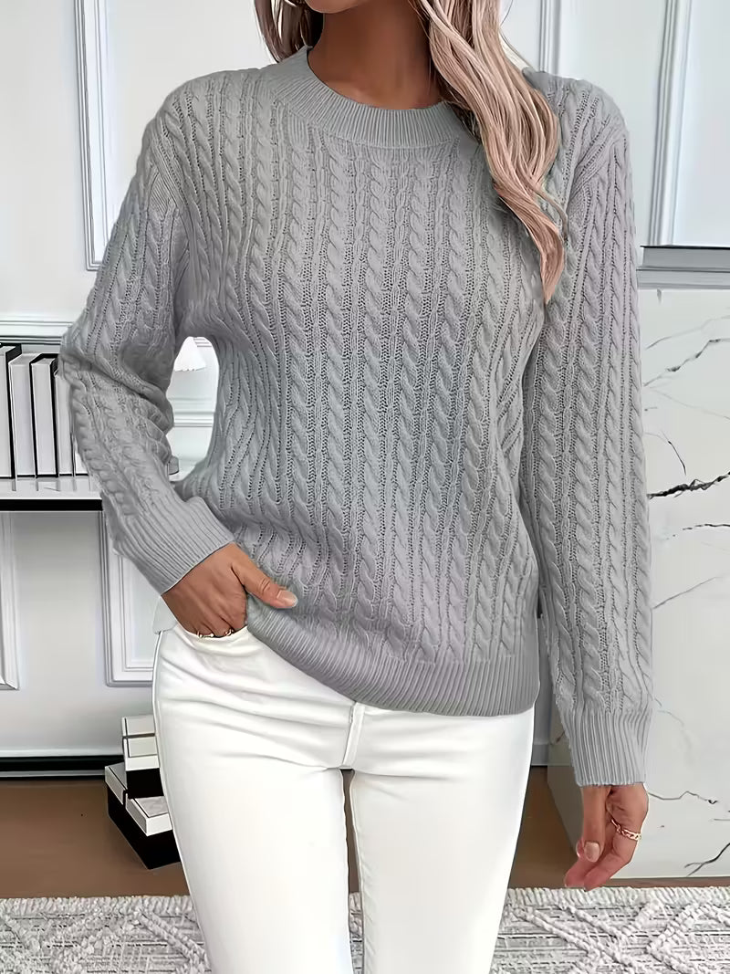 Soft and cozy women's crew neck cable knit sweater, a versatile addition to autumn wardrobes.