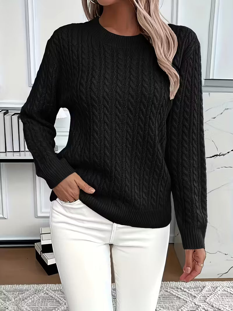Classic women's cable knit sweater with a flattering crew neck, designed for versatile autumn wear.