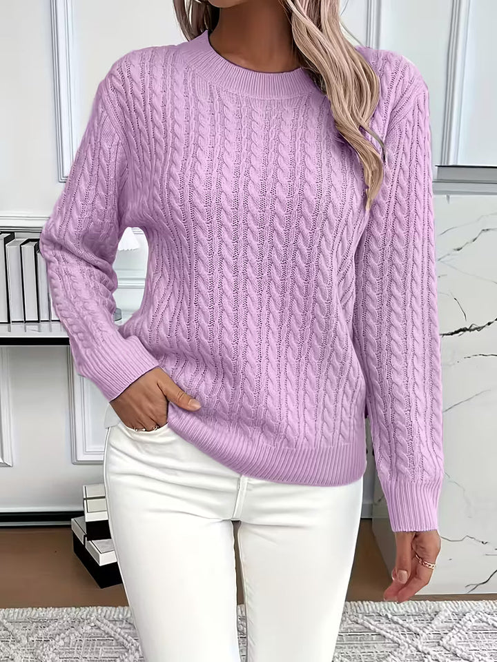 Elegant women's long sleeve cable knit jumper, offering warmth and style for autumn layering.