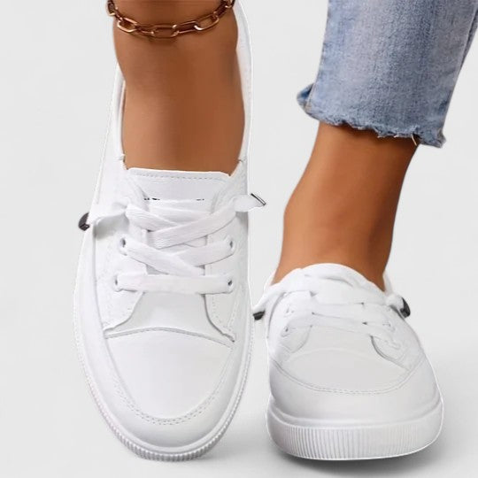 Side profile of women's breathable walking shoes, offering lightweight orthopedic support and arch comfort.