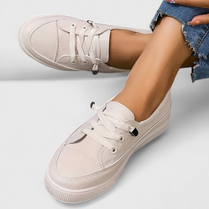 Close-up: breathable mesh fabric on women's lightweight walking shoes, ideal for daily wear and foot support.