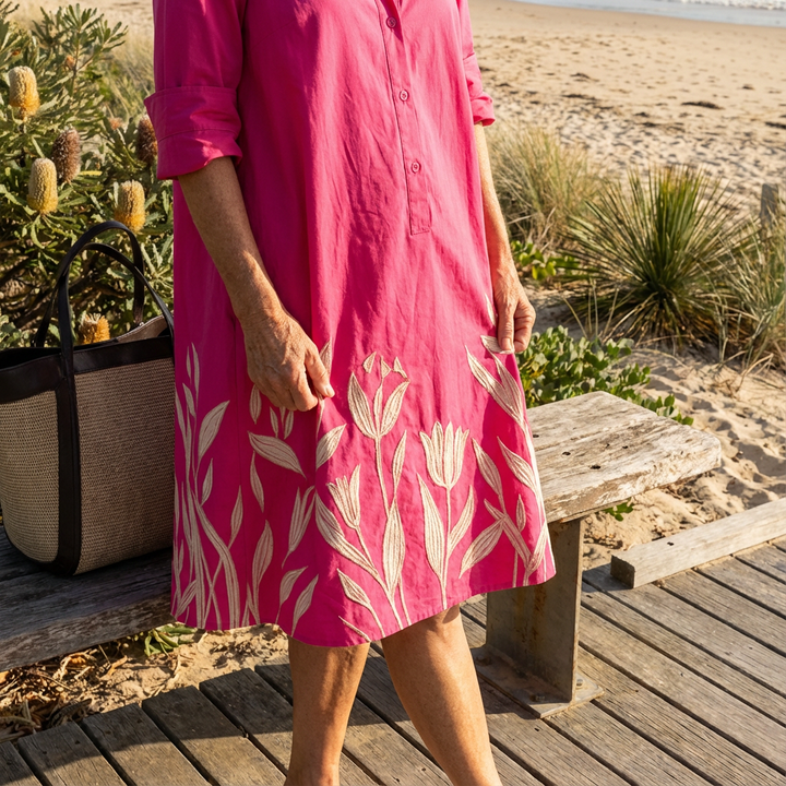 Luxe fuchsia floral embroidered button-down midi shirt dress for women. Sophisticated design & intricate details.
