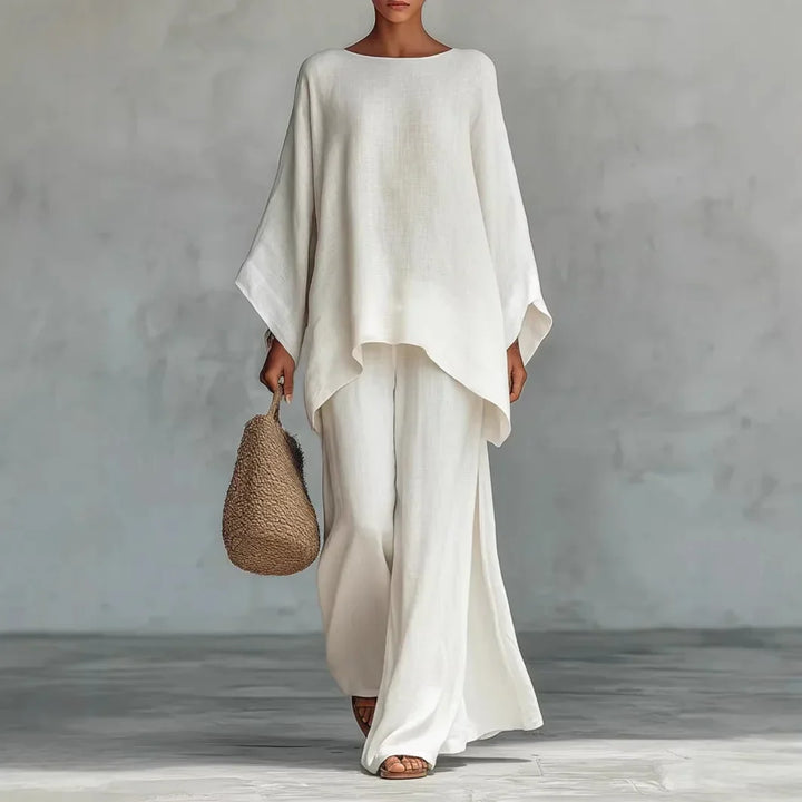 Full-length view of a women's flowy asymmetrical top and wide-leg pants matching set. Ideal for spring summer comfort.