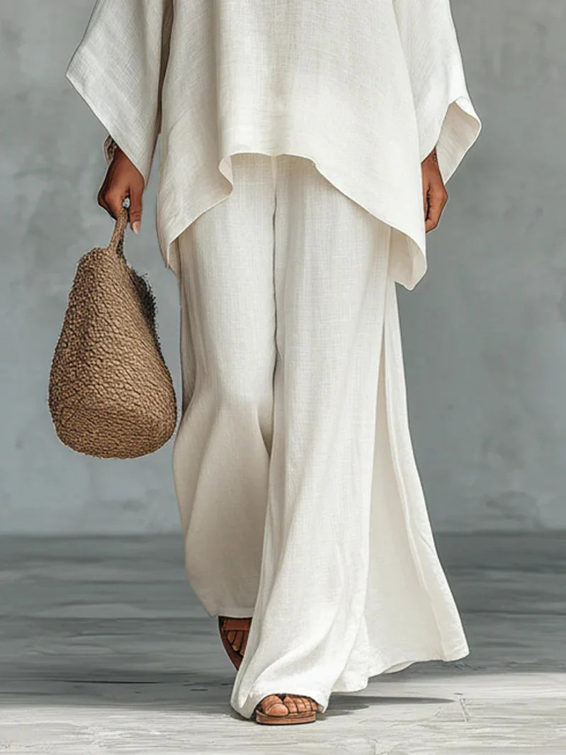 Stylish women's asymmetrical one-shoulder top, part of a two-piece casual elegant set. Perfect for spring fashion.