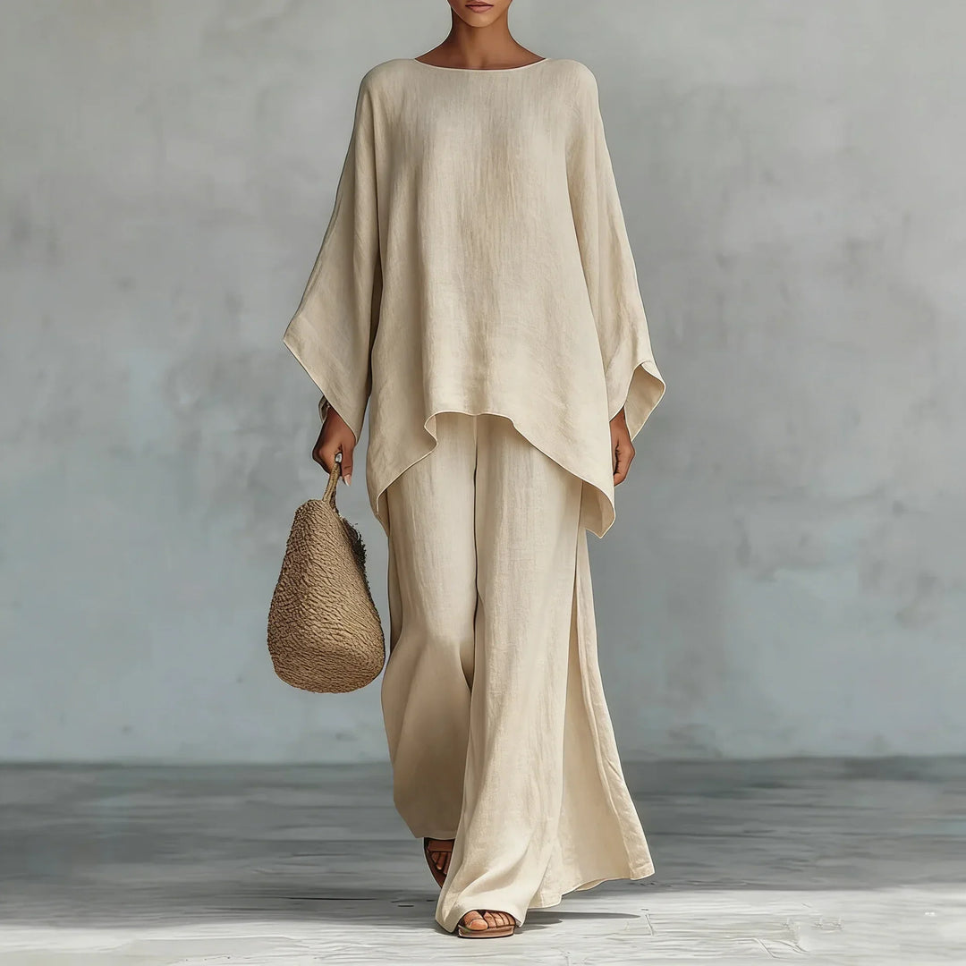Elegant women's matching set: flowy asymmetrical top and comfy wide-leg pants. Perfect for summer style & travel wear.