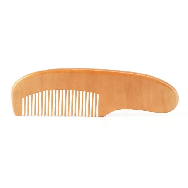 Packaged gentle newborn wooden comb with natural wool bristles, an essential baby grooming item