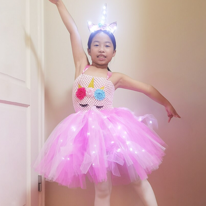 Girl in glowing LED Unicorn Tulle Party Dress, sleeveless, rainbow skirt, perfect for birthdays