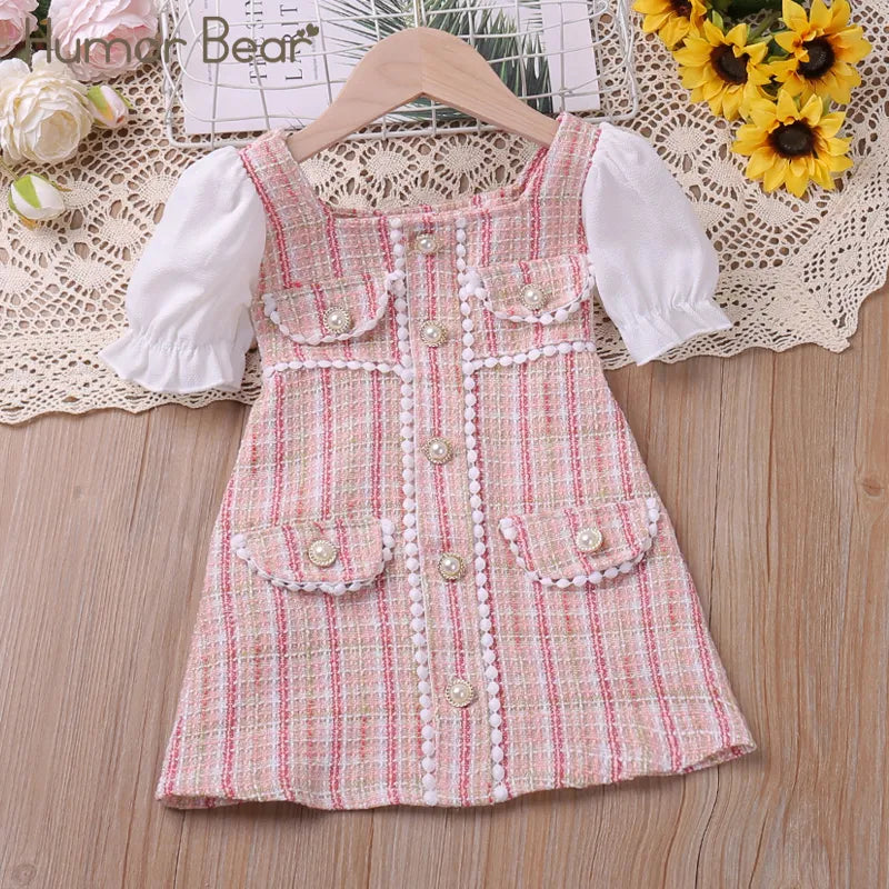Close-up of sweet summer floral princess dress for girls, showcasing print and fabric.