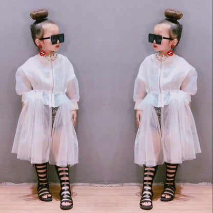 Stylish young girl in a vibrant mesh coat, excellent for spring or fall outerwear.
