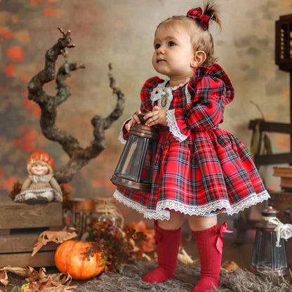 Girl's red plaid romper with ruffle detail, perfect for baby holiday wear or Christmas outfit.