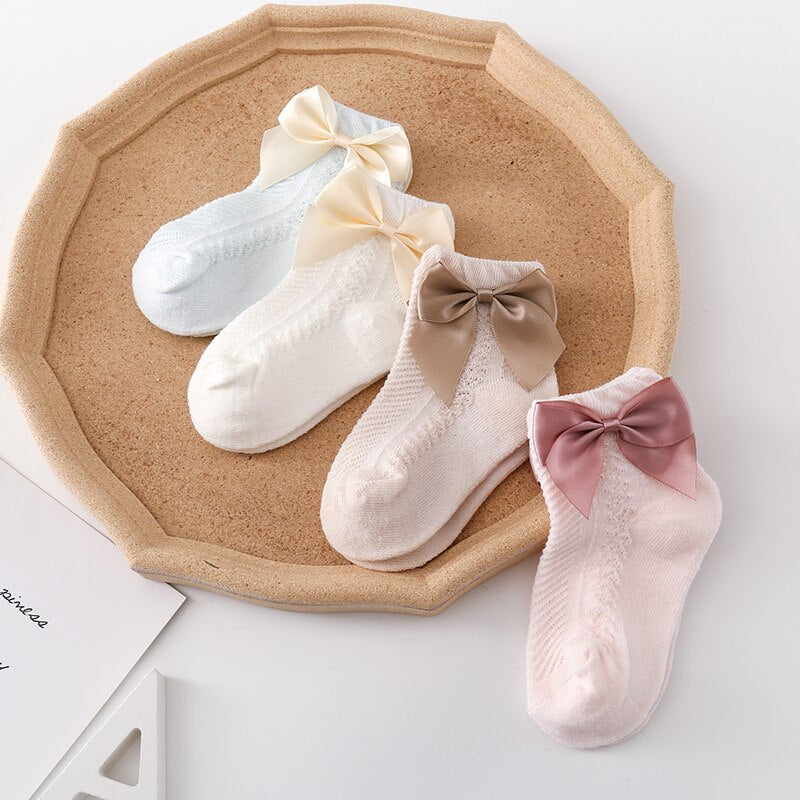 Cotton blend 3-pack mesh ankle socks for toddler girls, featuring delicate bows and a comfy fit