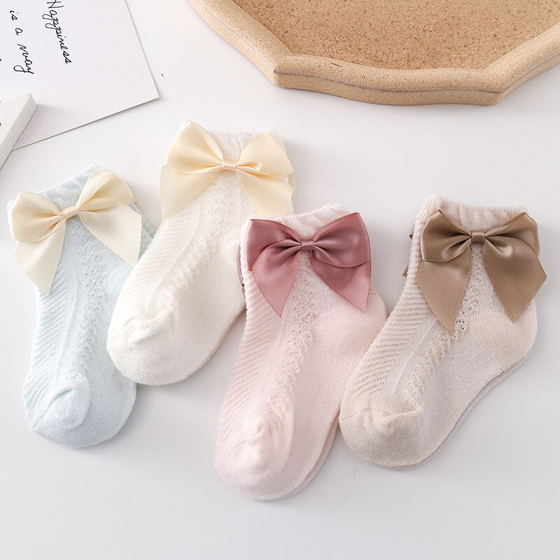 Breathable 3-pack mesh ankle socks for baby girls, decorated with small bows for a cute look