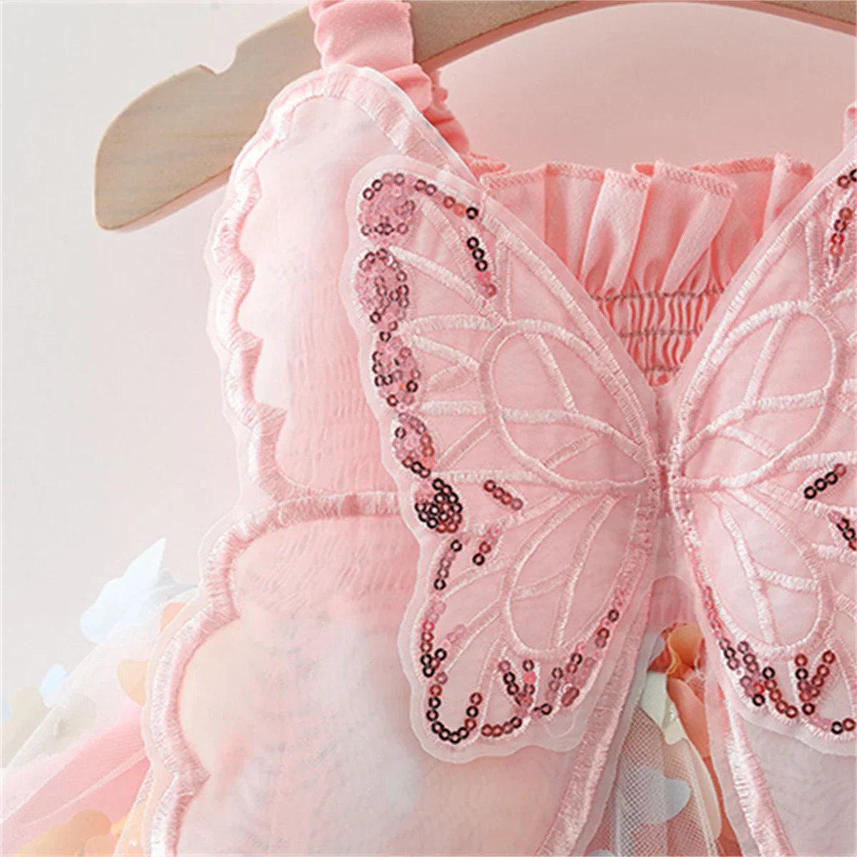 Detail of the soft cotton blend fabric of a girls' 3D butterfly princess summer dress