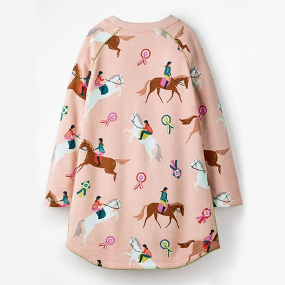 Cute girls' equestrian print long sleeve dress. Soft cotton, comfortable for everyday toddler wear & kids' fall fashion.