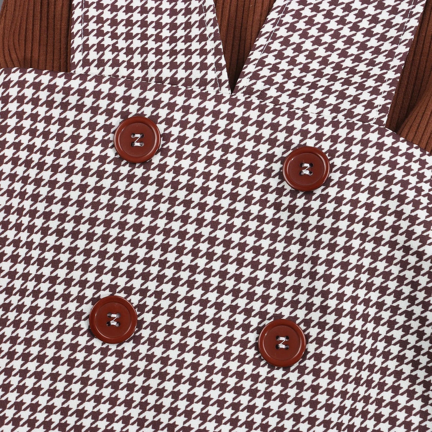 Detail shot of the soft, cream-colored turtleneck top for girls' autumn comfortable fashion.