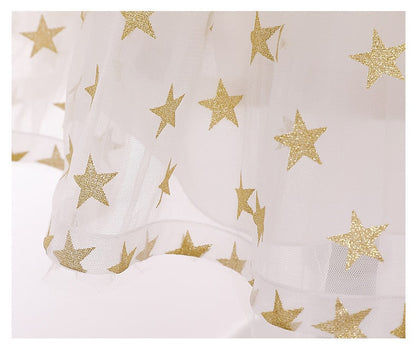 Close-up of shimmery sequins & star details on a girls' backless princess dress, ideal for parties.
