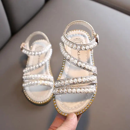 Side view of girls' summer sandals, featuring bling rhinestones and comfort design