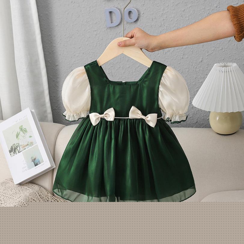 Two-piece girls' cotton blend outfit: puff sleeve dress and romper, featuring a lovely bow design.