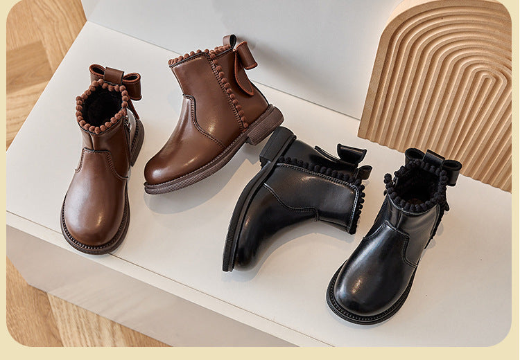 Stylish black faux leather ankle boots for girls, featuring a functional zipper, essential footwear.