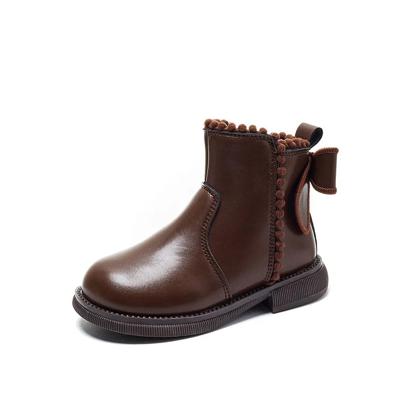 Side view of a girl's faux leather ankle boot in brown, highlighting the comfortable design and zipper.
