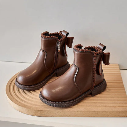 Two pairs of girls' faux leather ankle boots, one black and one brown, showcasing zipper detail.