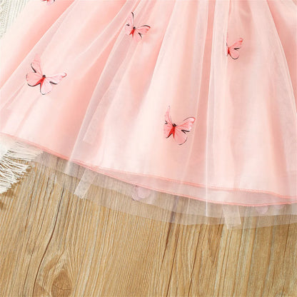Model wearing a Girls' Butterfly Mesh Summer Dress from Sweet Beauty Collection