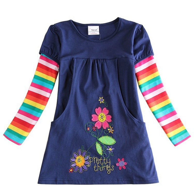 Laying flat, a Girls' Butterfly & Stripes Long Sleeve Knit Dress, showcasing its full design and colors