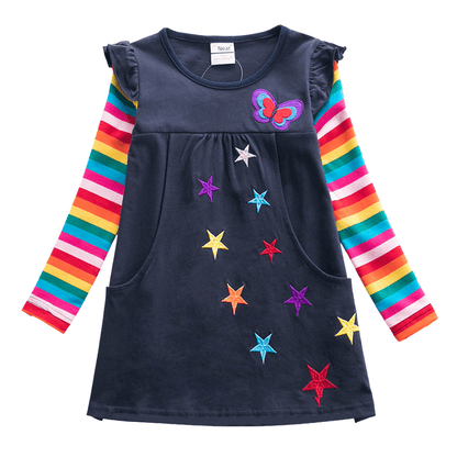 Toddler girl in a long sleeve knit dress featuring a vibrant butterfly and stripe pattern, comfortable cotton