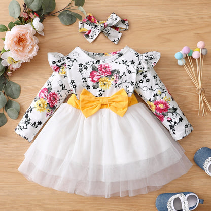 Close-up of pink & white candy striped summer dress for girls with cute headband