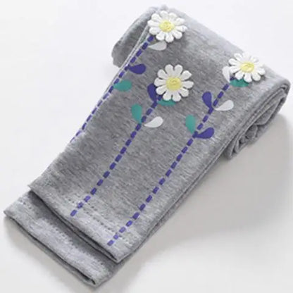 Stretchy girls' skinny pants with various cartoon designs, comfort-focused playwear.