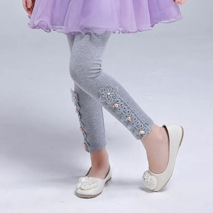 Childrens clothing: skinny leggings with engaging cartoon prints, easy-care fabric.