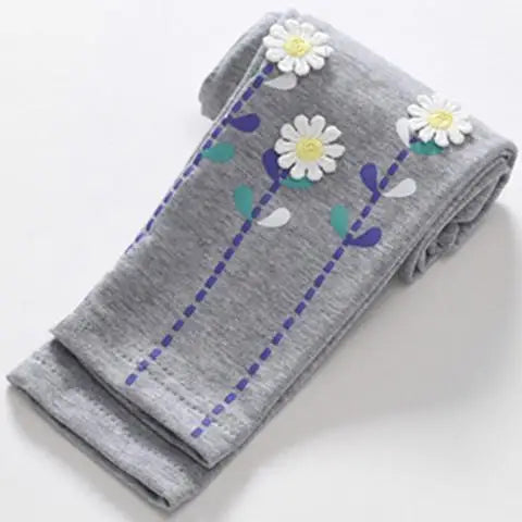 Everyday girls' playwear: robust cartoon print skinny leggings with a secure elastic band.