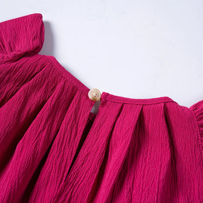 Sweet flying sleeves detail on a sleeveless pink girls' casual summer dress