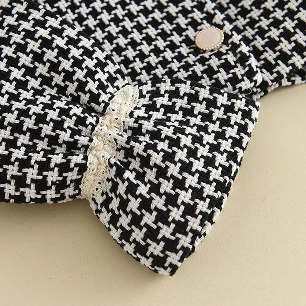 Close-up of the stitching and quality of the girls' retro coat, built to last