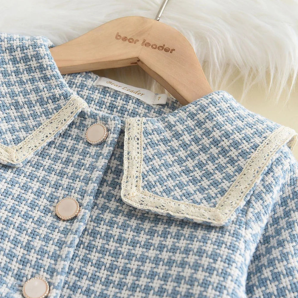 Close-up of the checkered pattern on the girls' tank dress, high-quality fabric
