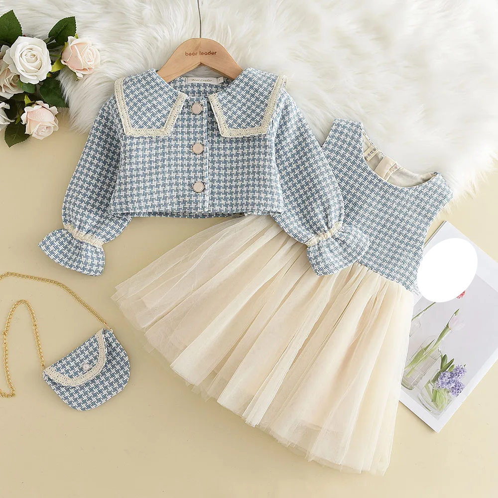 Girls' plaid tank dress with a ruffled hem, paired with a vintage-style coat