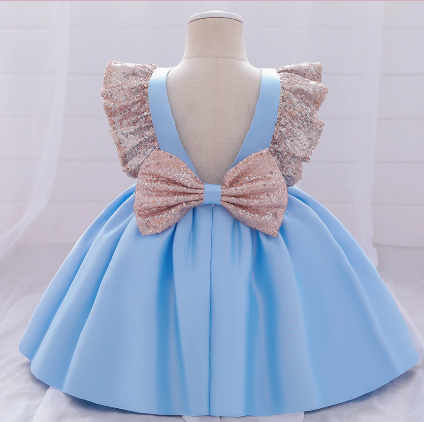 Toddler girl in a sparkling sequin bow plaid dress, ideal Christmas dress for special occasions